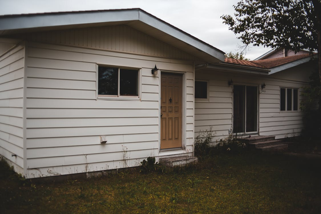House before patio and landscaping
